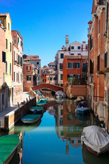 traditional Venice canal with bridge and historical old houses, Italy