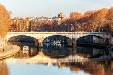 Ancient stone bridge on the river in Rome