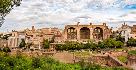 High view on the Roman Forum with cloudy sky on the background