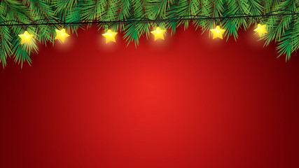 Christmas tree branches and stars lights over red background