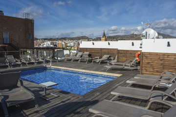 Fototapeta na wymiar Spain - Malaga swimming pool on the rooftop at downtown