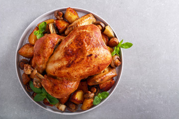 Roast chicken with roast potatoes and mushrooms