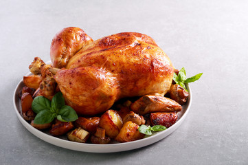 Roast chicken with roast potatoes and mushrooms