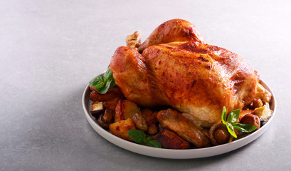 Roast chicken with roast potatoes and mushrooms