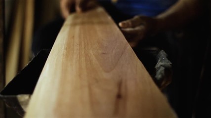 Luthier Heating the Wood in the Fire. Craft Workshop of Harps in Asuncion, Paraguay. Close-Up. Full HD. 