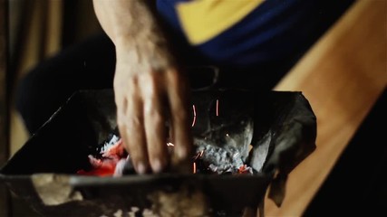 Luthier Heating the Wood in the Fire. Craft Workshop of Harps in Asuncion, Paraguay. Close-Up. Full HD. 
