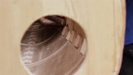Luthier Sanding The Wood. Manufacture Of A Musical Instrument.