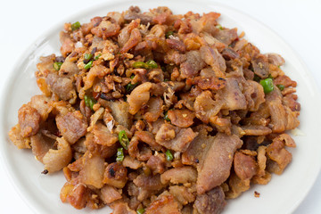 fried pork belly with fish sauce isolated on white background