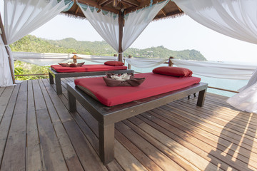 Massage table overlooking the sea. Spa massage room on the beach in Thailand