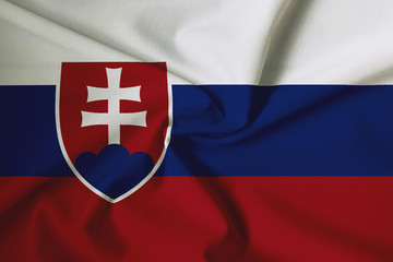 National flag of Slovakia on a waving cotton texture background