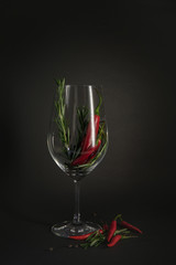 red chili peppers in a rosemary glass