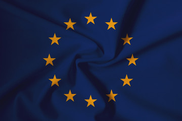 Waving EU flag with a fabric texture