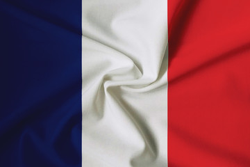 Waving French flag with a fabric texture