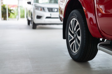 closeup car wheel with soft-focus and over light in the background