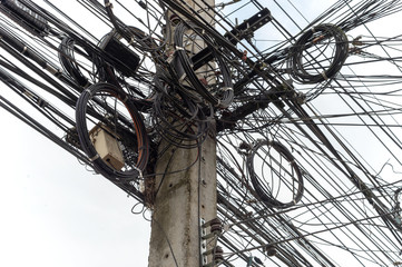 closeup electricity post with soft-focus and over light in the background