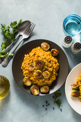 risotto with pumpkin and brussels sprouts on the table. A healthy recipe for the whole family. festive table