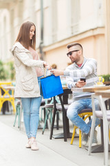 Young couple outdoors in a cafe