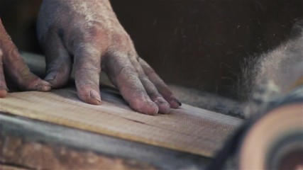 Carpentry Workshop. Carpenter Cutting the Wood. 