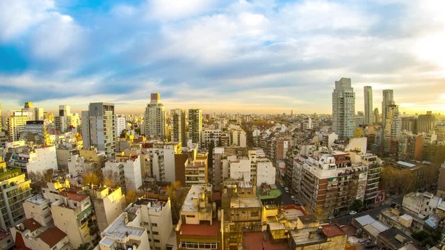 Time-lapse view on the skyline of the city as colorful clouds pass by in the light of the setting sun in Buenos Aires, Argentina.

