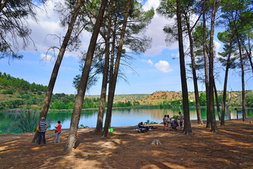 Lagunas de Ruidera, Spain - September 22, 2018: Several bathers spending the day in the Lagunas de Ruidera.
