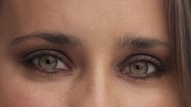 argentine woman eyes watching to the camera. Closeup