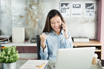 New generation business woman using smartphone,Asian woman are happily working in the office,Working Successful Concept