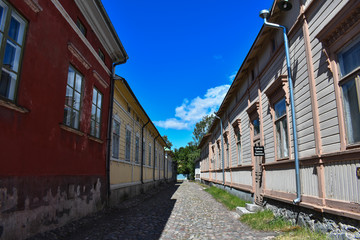 Fototapeta na wymiar One of Old Rauma's streets that looked so empty without the people passing by.