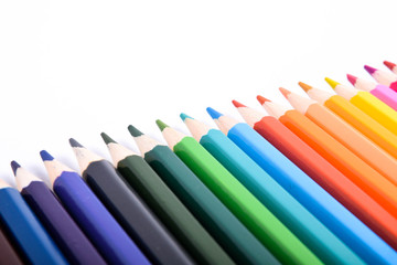 Colorful pencils pattern isolated on white background. Top view colorful of color pencils.Colored pencils, isolated on the white background. Color pencil with copy space isolated on white background,e