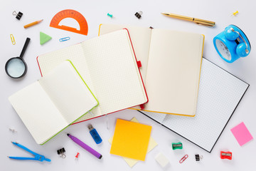 school accessories and open notebook or book