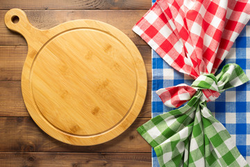 cutting board at wooden table