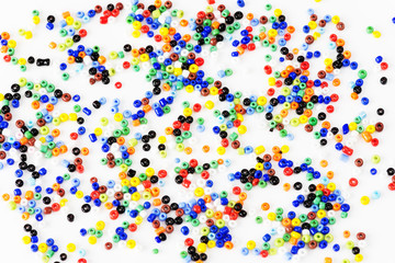 Multi-colored beads on a white background - 226349555