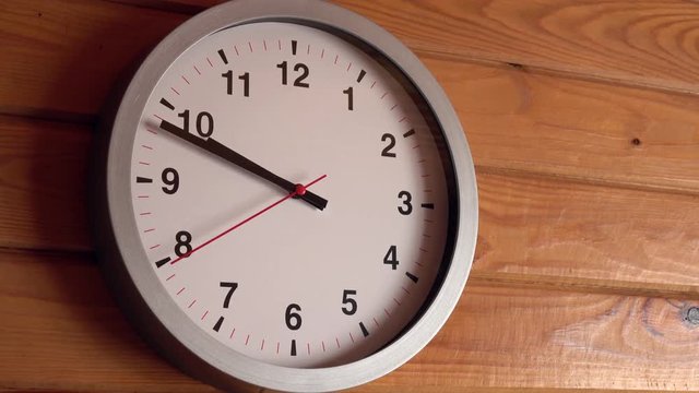 3 minutes time lapse close up shot of office clock on wood wall background. 4K.
