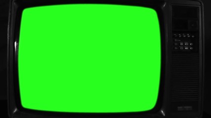 Old Television with Green Screen. Black and White Tone. Ready to Replace Green Screen with Any Footage or Picture you Want. You Can Do it With “Keying” (Chroma Key) Effect. Zoom Out. Close-Up. Full HD