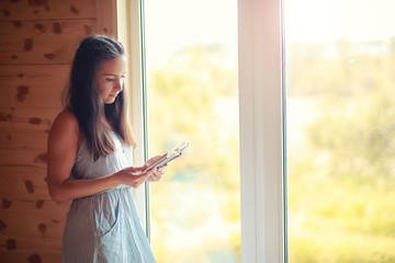A girl at the window in the house