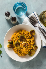 risotto with pumpkin and brussels sprouts on the table. A healthy recipe for the whole family. festive table