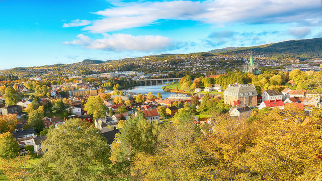 Fall in Trondheim, aerial view of the river Nidelva , the cathedral Nidarosdomen and residential district during indian summer in October 