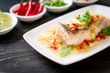 Steamed Grouper Fish Fillet with Chili Lime Sauce in lime dressing