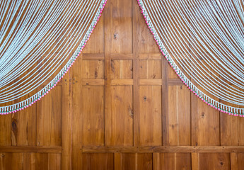 Wooden wall with decoration arch in Thai style for engagement