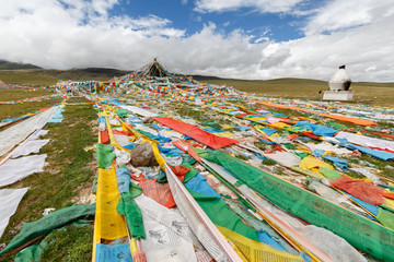 Colorful prayer flags in the mountains on the way to Nam Tso Lake, Tibet / China. Prayer flags are often used to bless the surrounding countryside.