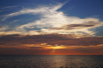 Sunset Pierces the sky in Karon Beach, Phuket.,