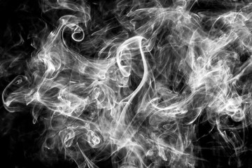 Beautiful white smoke over black background. Abstract smoke or fog texture background pattern.