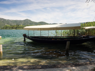 Boat at beautiful Bacina lakes in Dalmatia,Croatia - holiday destination