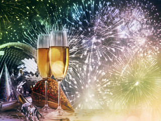Two champagne glasses against New Year celebrations