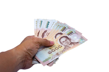 Hand of a businessman holding a thailand currency, Hand holding 1000 bath Thai money isolated on white background with clipping paths.