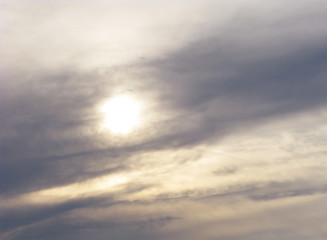 Fototapeta premium Dark clouds. The sun in a gloomy and tense sky. Bad weather.