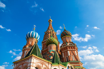 Fototapeta na wymiar Saint Basils cathedral on Red Square in Moscow. Famous russian landmark on blue sky background.