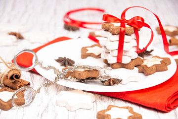 Holiday concept with red napkin, cookies and spices