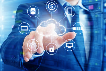 Double exposure of professional businessman connected devices with Cloud technology internet and wireless network on touch screen and city of business background in business and technology concept