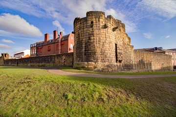 Newcastle Upon Tyne’s medieval castle walls that surround the city and image is taken from the moat on the outer side © Harry Green