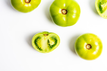Green tomato on white background